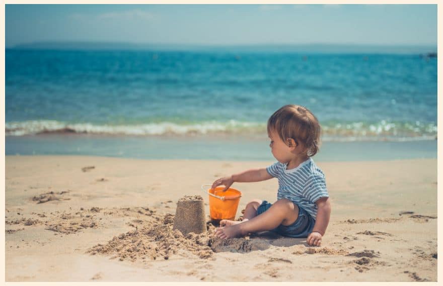 Toddler building a sandcastle 
