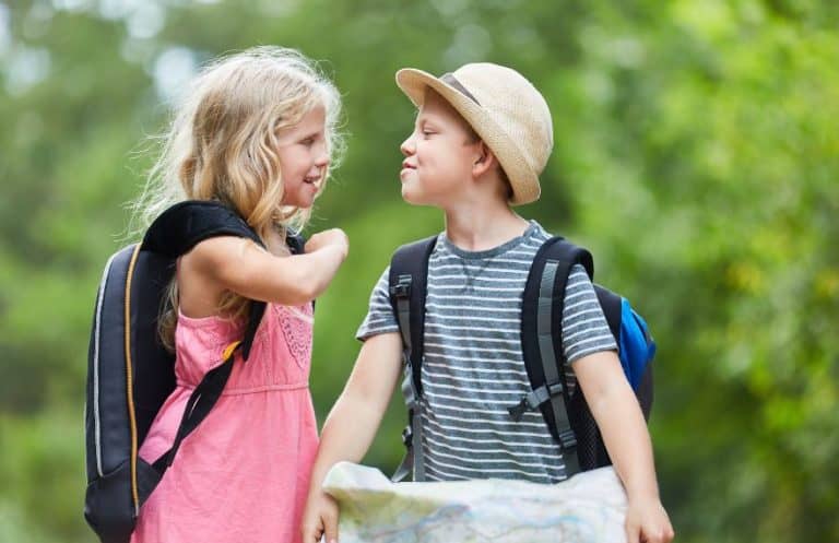 Two kids looking at a hiking map