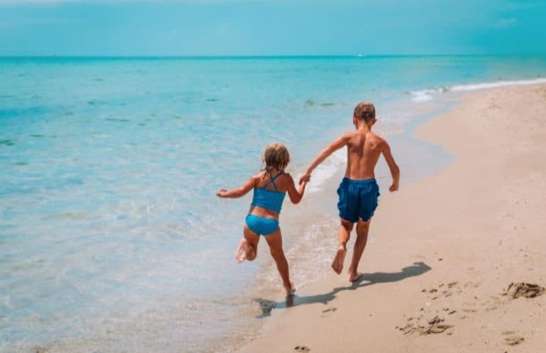 Kids running at the beach